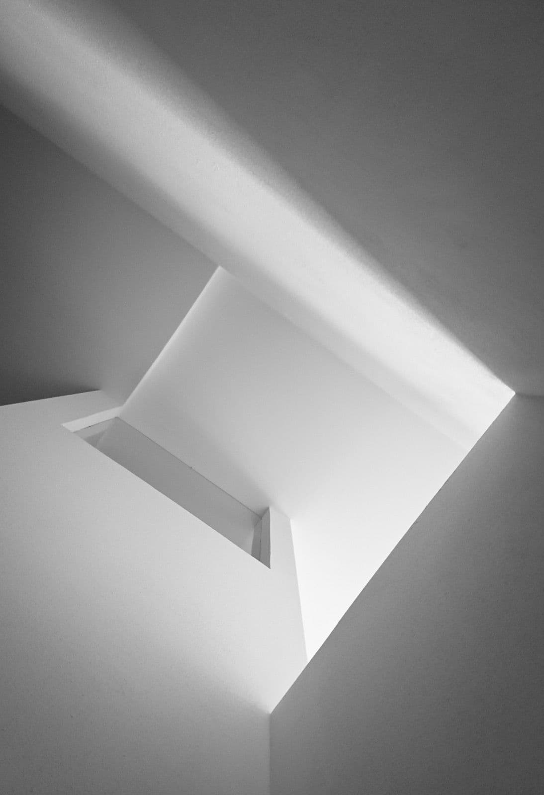 Top-lit stairwell washed in daylight