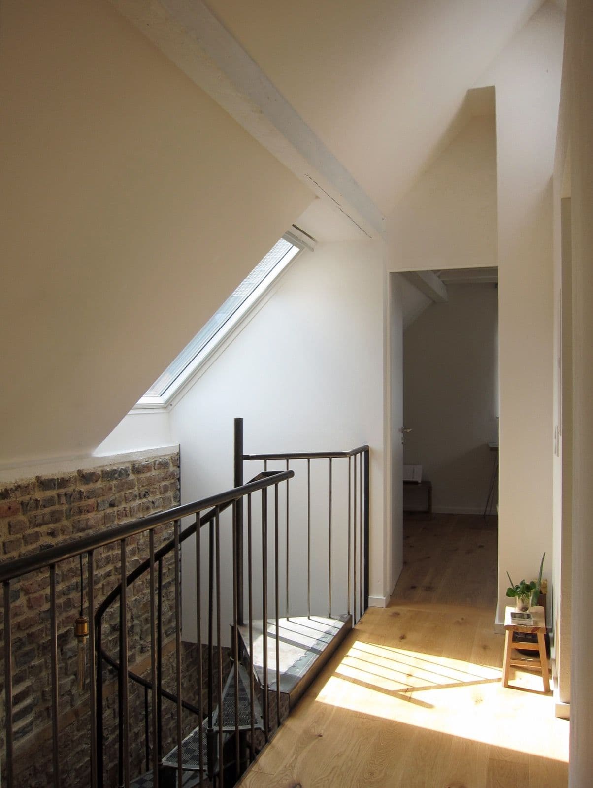 Light shaft falling down a white stair